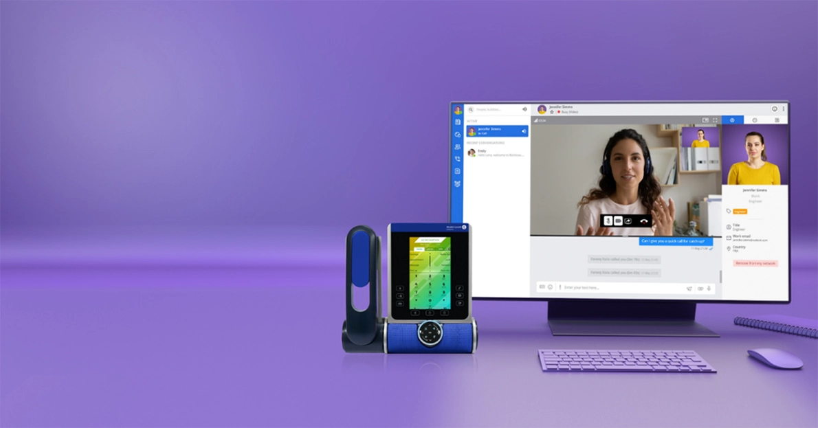 Eine typischer digitaler Arbeitsplatz mit DECT-Telefon und PC, eingefärbt in eine lila Bildstimmung